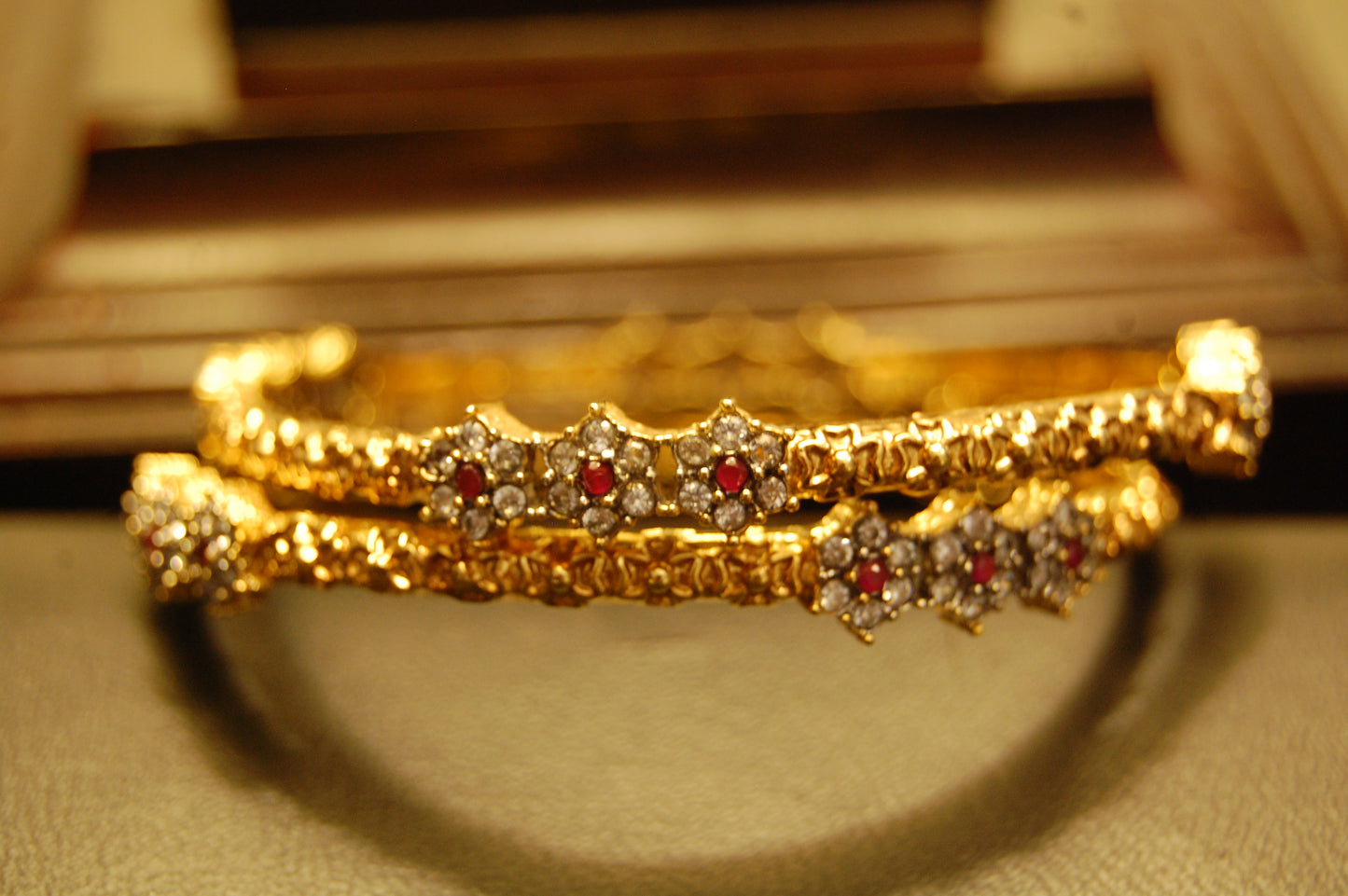 PAIR OF ELEGANT FLORAL RED & ZIRCON BANGLE