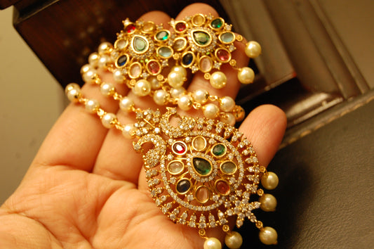 INDIAN MULTI JEWELLED PENDENT IN PEARL STRING