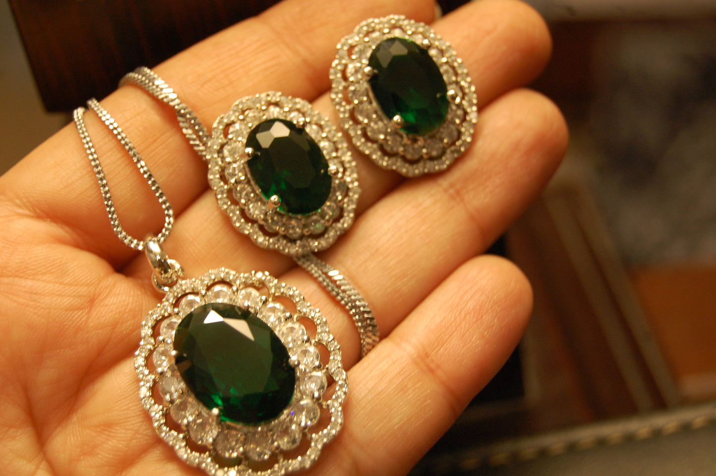 EMERALD GREEN PENDENT SET IN ZIRCONS