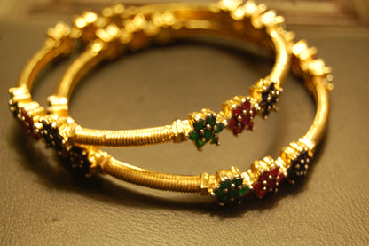 PAIR OF ELEGANT MULTI STONE BANGLES