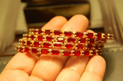 SET OF 4 RED & ZIRCON BANGLES IN GOLDEN BASE