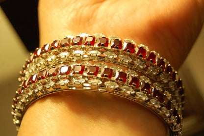 PAIR OF RED & ZIRCON BANGLES IN SILVER BASE