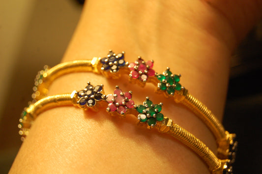PAIR OF ELEGANT MULTI STONE BANGLES