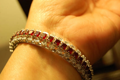 PAIR OF RED & ZIRCON BANGLES IN SILVER BASE