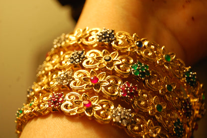 PAIR OF MULTI STONE BANGLES