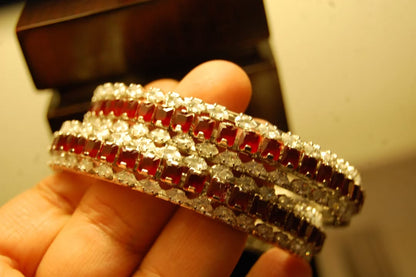 PAIR OF RED & ZIRCON BANGLES IN SILVER BASE